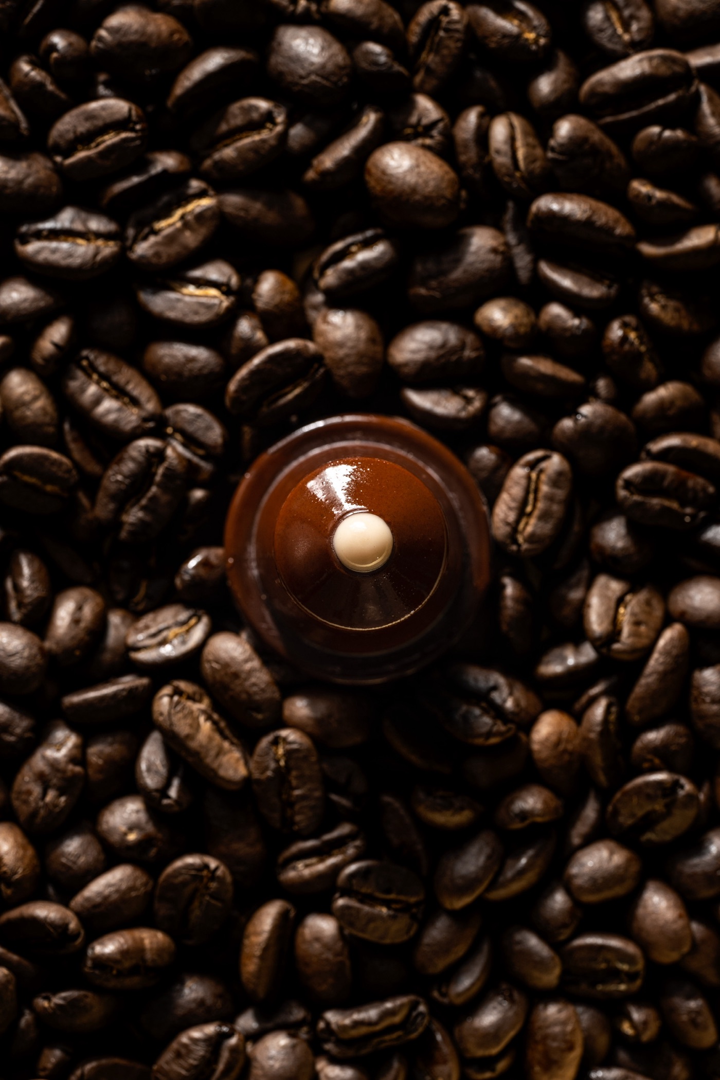 Capsule signature CAPSULATE sur grains de café